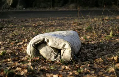 Mattress discarded in the environment