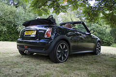 Side and rear view of black Mini Cooper S Convertible by themullett on Flickr