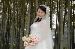 Asian woman modeling a bamboo wedding dress. Credit this image to YakoBusan CC at Flickr